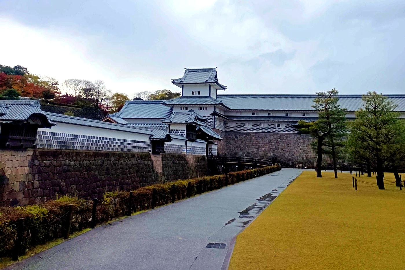 The ramparts and keep of Kanazawa castle, white walls and gray roofs.